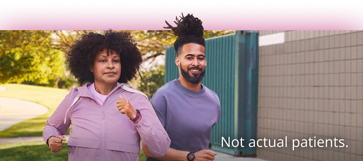 A man and woman running. Not actual patients.